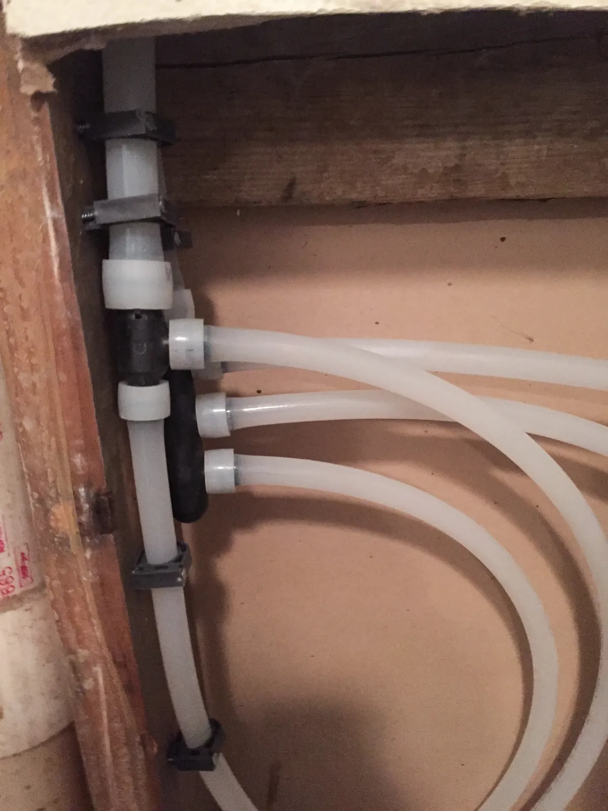 New white PEX supply lines routed through an open wall – Shower Valve Replacement for Coto de Caza, CA homes