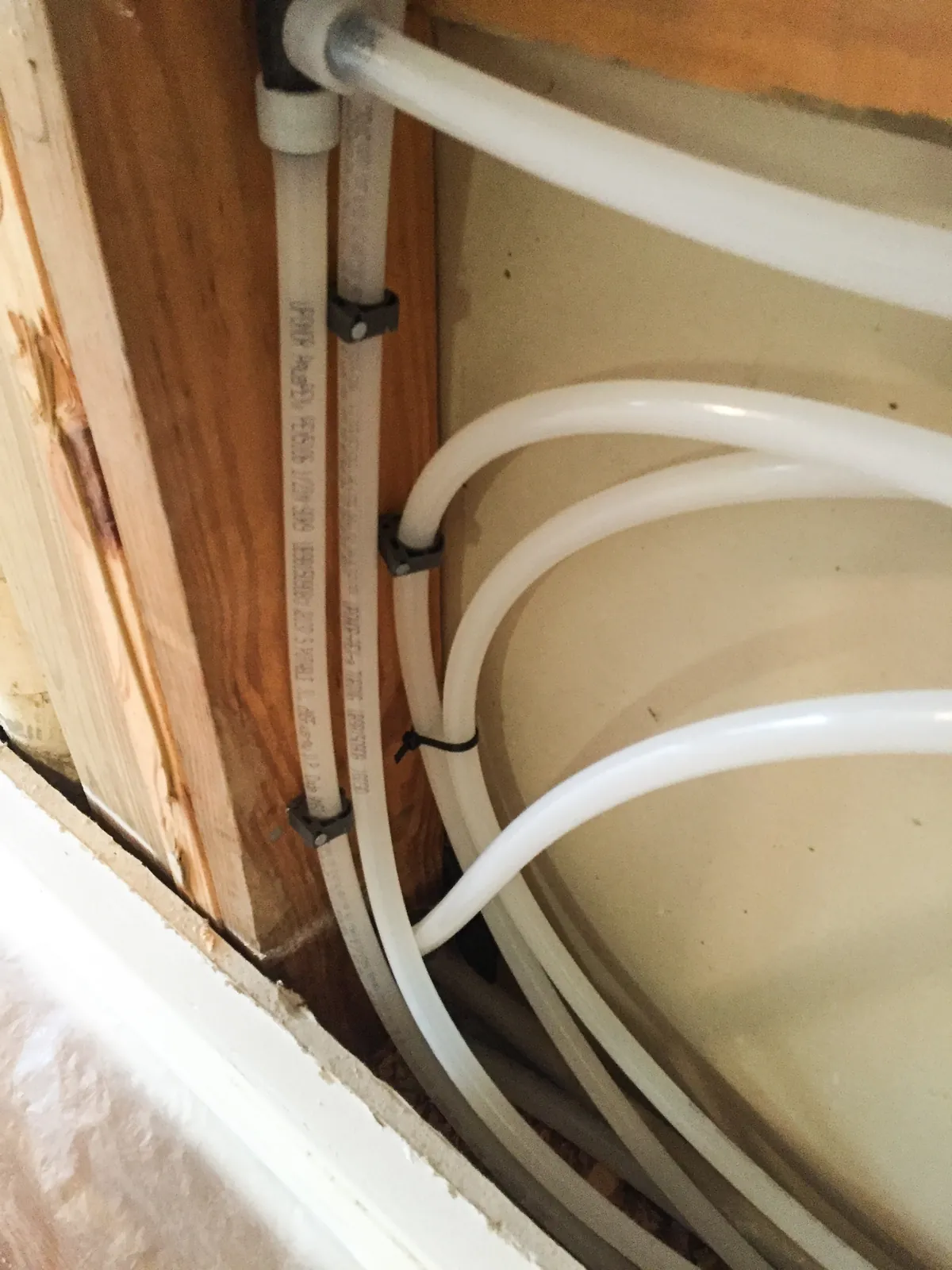 PEX repipe lines looped through wall framing before drywall – What to Expect From a Navien Tankless Water Heater Installation for Coto de Caza, CA homes