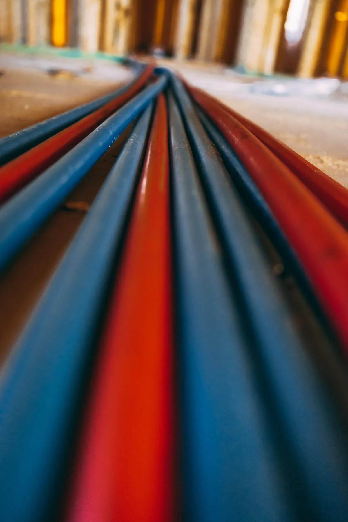 Coiled red and blue PEX tubing ready for a repipe, from our Coto de Caza guide: Water Line Size for Large Coto de Caza Homes