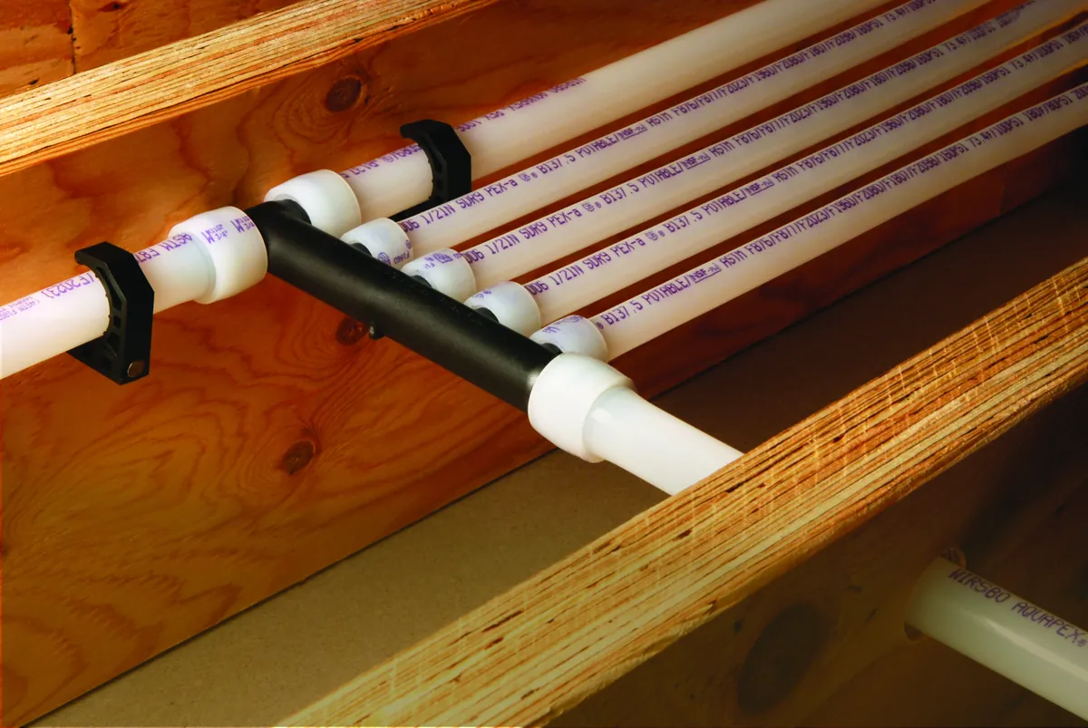 PEX multiport tee mounted across floor joists – Does Your Coto de Caza Home Need a Water Pressure Booster Pump? Hilltop Lots, Long Runs and Better Options for Coto de Caza, CA homes